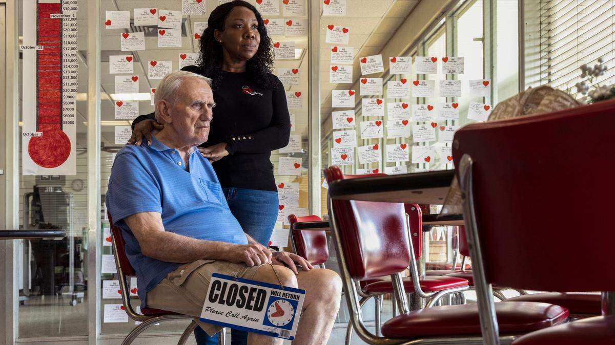 Bob Maguire, 85, left, and partner Rita Tennyson, right, hope that they can get a new lease and continue to operate the beloved Coral Gables dinner at its original location on Monday, December 20, 2021. Burger Bob’s operators fear the end of their lease may close the doors of the well-loved diner as new developers of the property may bring an end of decades of operation.