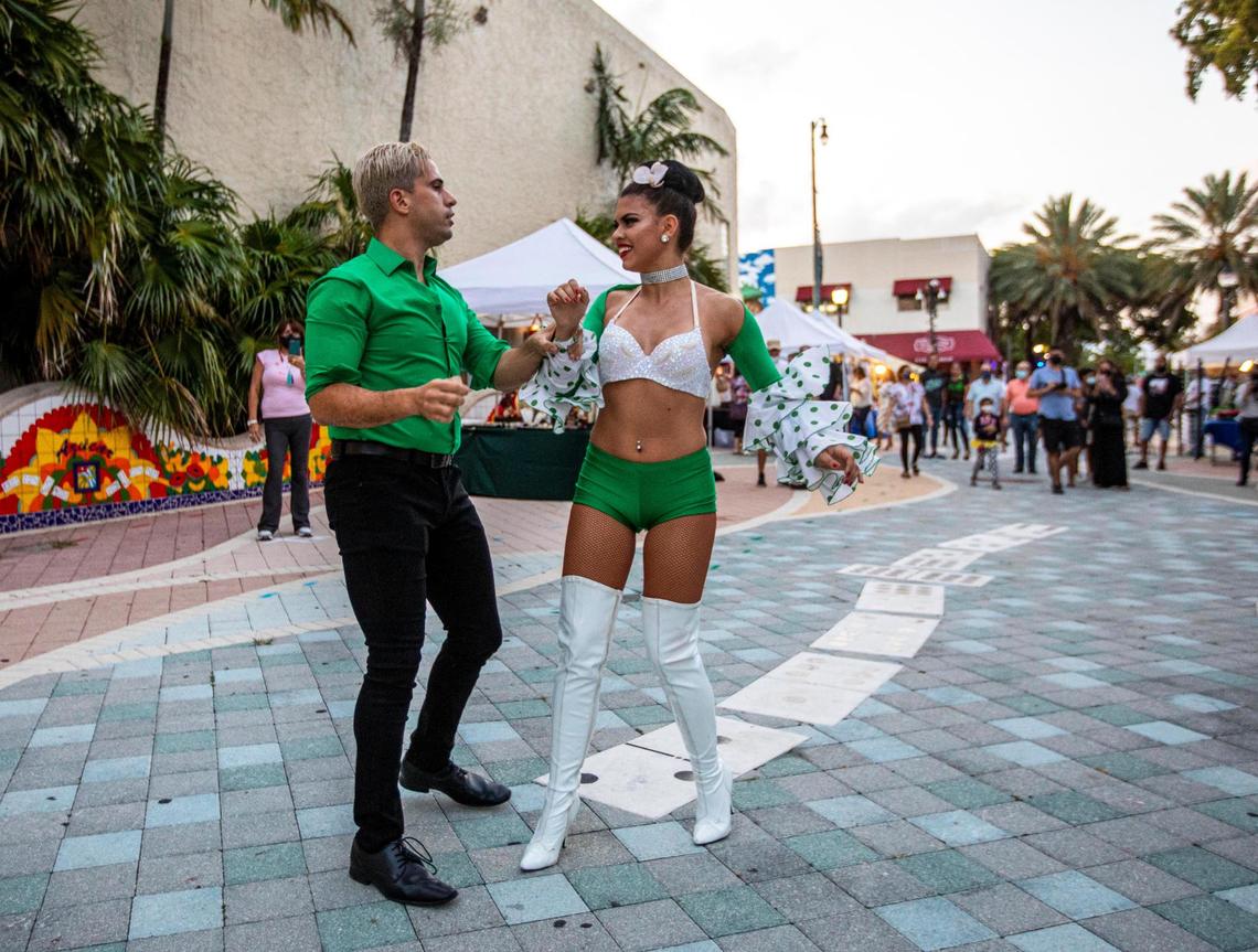 Lidia Llanes and René Rodriguez dance during Viernes Culturales or Cultural Fridays on Calle Ocho in the Little Havana neighborhood of Miami, Florida, on Friday, May 21, 2021.