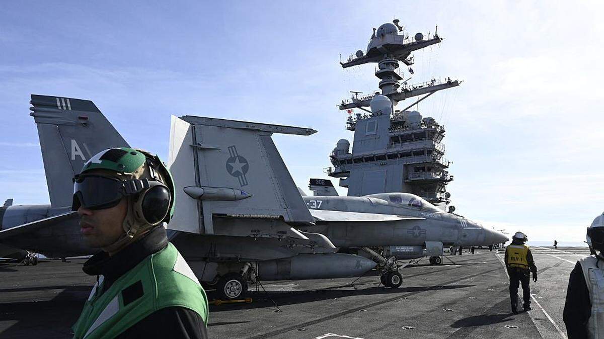 F-18E fighter jet is seen on aircraft carrier USS Gerald R. Ford as it sails during NATO Neptune Strike 2025 exercise on September 24, 2025 in the North Sea. According to NATO, more than 10,000 sailors, soldiers, aviators and marines from 13 allied nations took part in the large-scale multinational enhanced Vigilance Activity, running from September 22 to 26, 2025 in an area spanning the Mediterranean, Adriatic, North and Baltic Seas. (Photo by Jonathan KLEIN / AFP) (Photo by JONATHAN KLEIN/AFP via Getty Images)