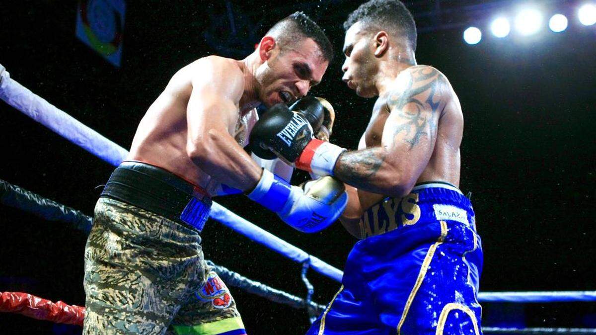 Hairon Socarras, right, hits Jesus Martinez on May 11.