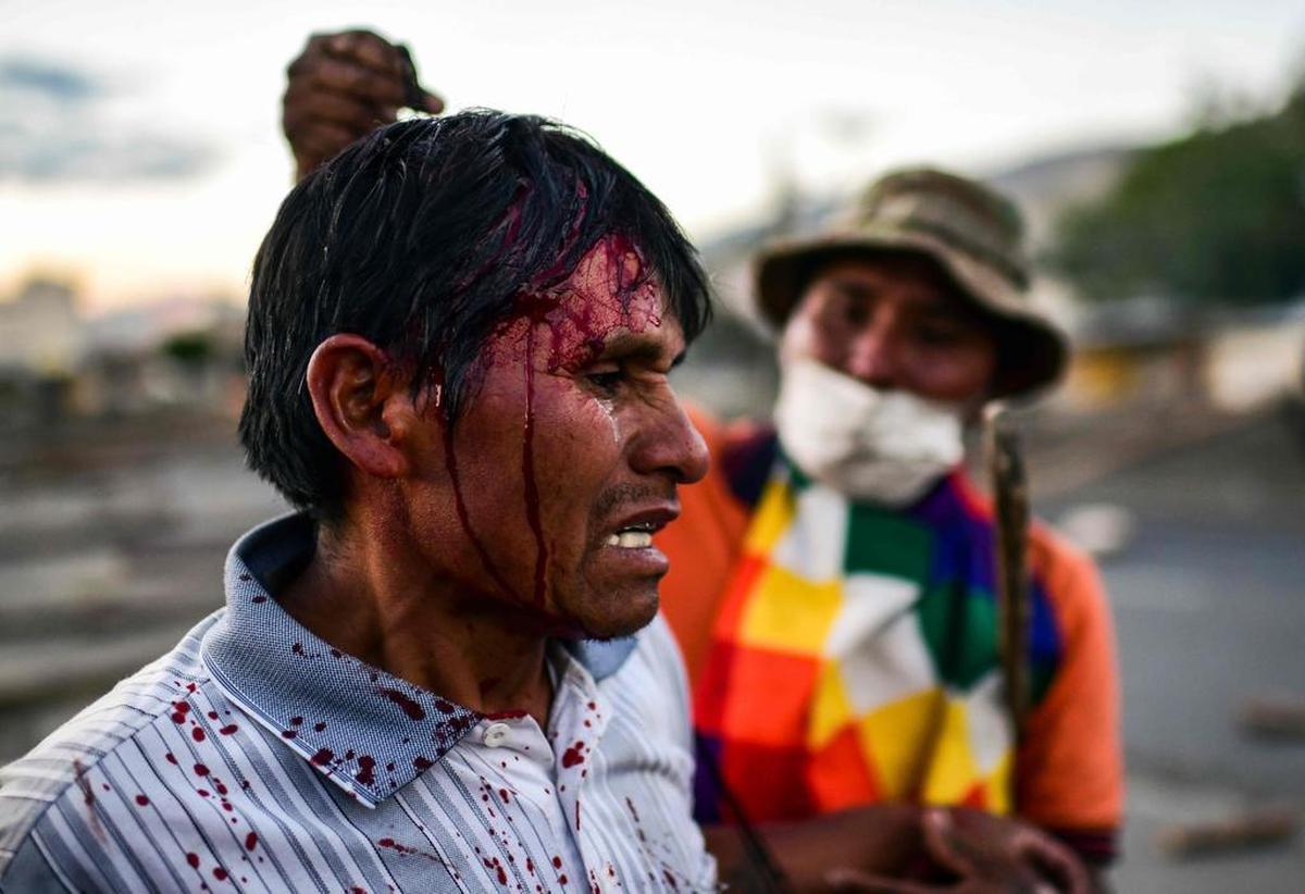A supporter of ex Bolivian President Evo Morales after clashing with riot police on the outskirts of Sacaba, in Chapare province Cochabamba, Nov. 18, 2019.
