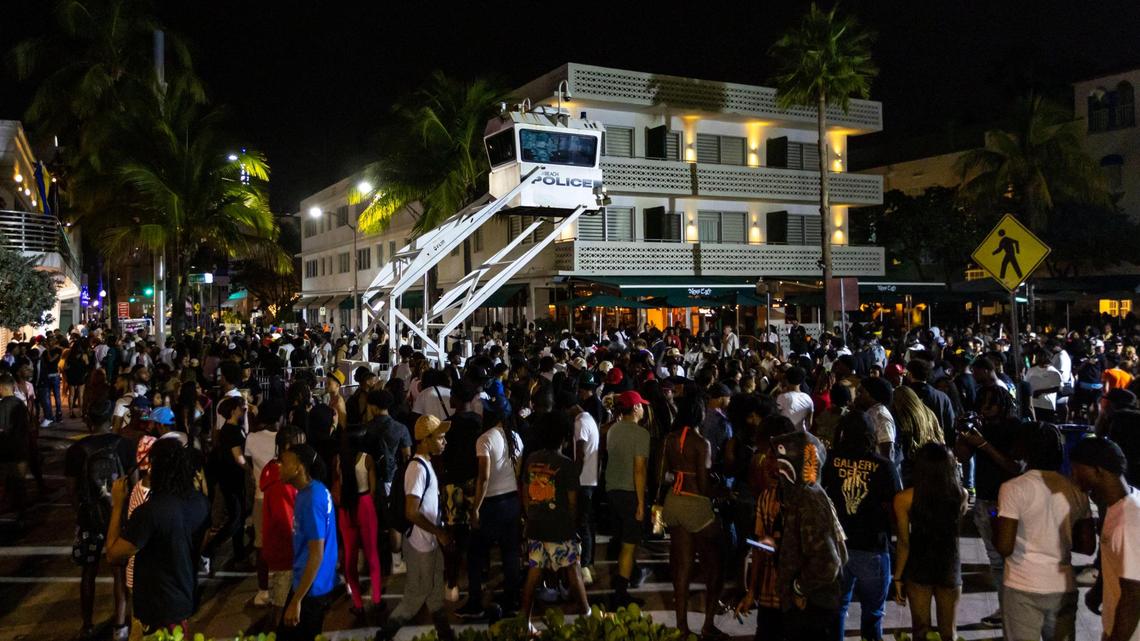 Huge spring break crowds gather on Ocean Drive Saturday. night. Two people were shot during the weekend. The city has issued a curfew starting Sunday night.