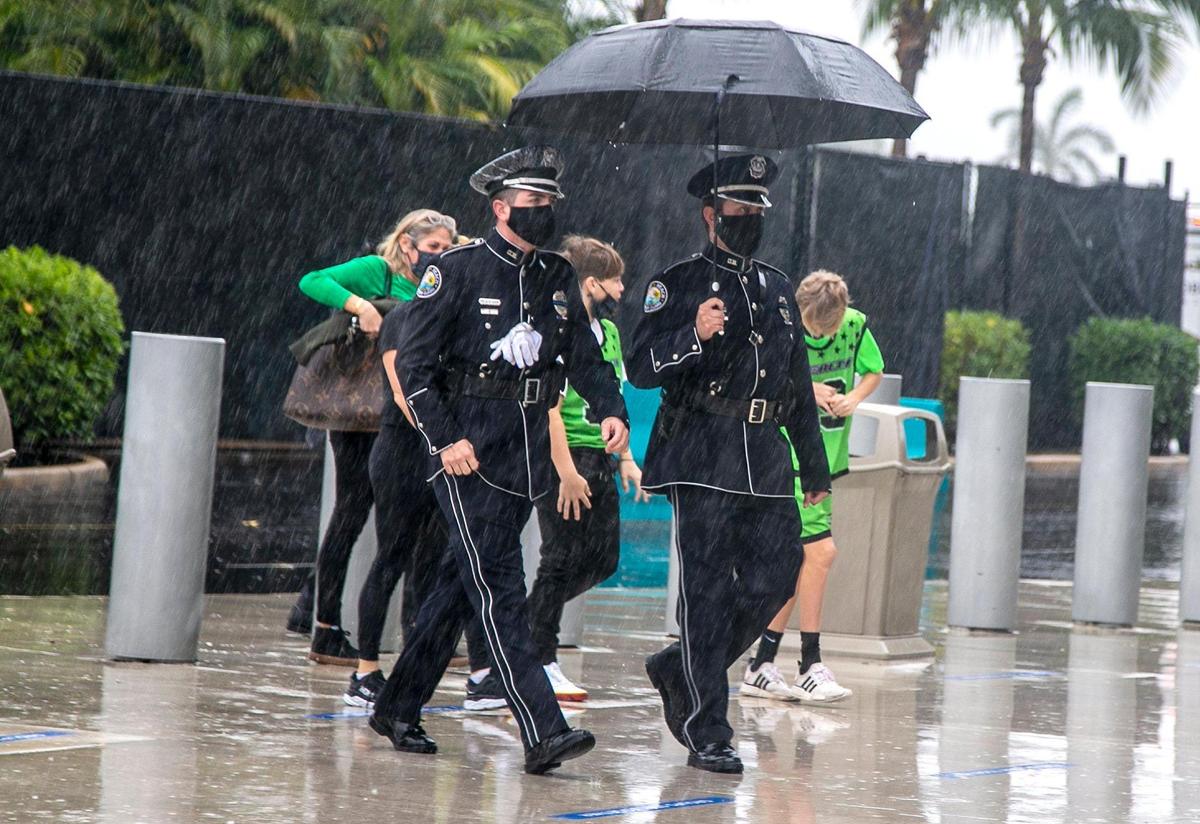 Law enforcement officers arrive at the memorial services for slain FBI Special Agent Laura Schwartzenberger at Hard Rock Stadium in Miami Gardens on Saturday, February 06, 2021. Schwartzenberger was one of two FBI agents killed Tuesday in Sunrise while serving a warrant.