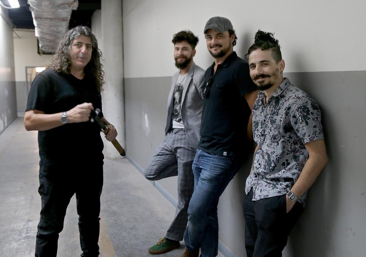 From left, “Plantados” director Lilo Vilaplana , and actors Héctor Medina, Ariel Texidó and Yerandy Basart in a building reconstructed to look like a Cuban prison in Miami.