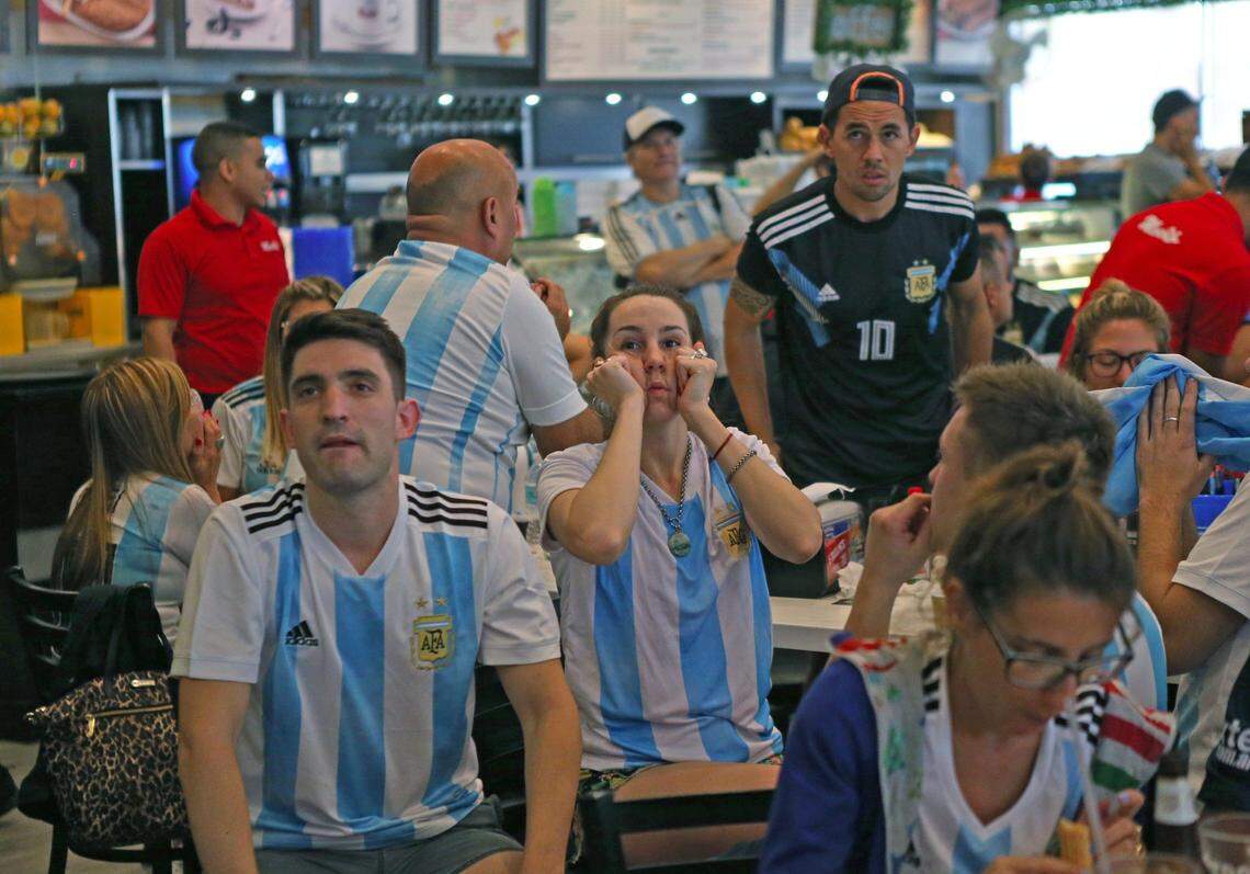 Fans of Argentina’s national soccer team react after Croatia scores the third goal as they watch a television broadcast of the Russia 2018 World Cup match between Argentina and Croatia at Manolo on June 21, 2018, in Miami Beach.