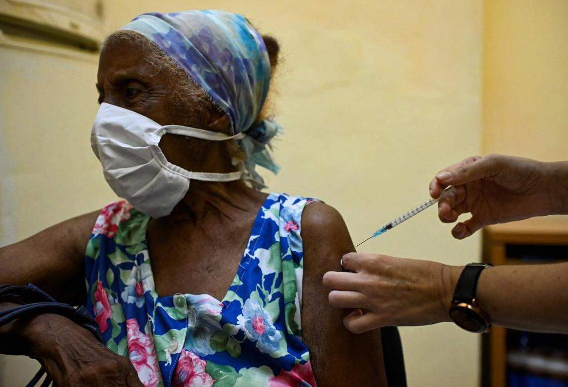 A nurse vaccinates an elderly woman against COVID-19 with Cuban vaccine Abdala in Havana, on August 2, 2021. (Photo by YAMIL LAGE / AFP) (Photo by YAMIL LAGE/AFP via Getty Images)