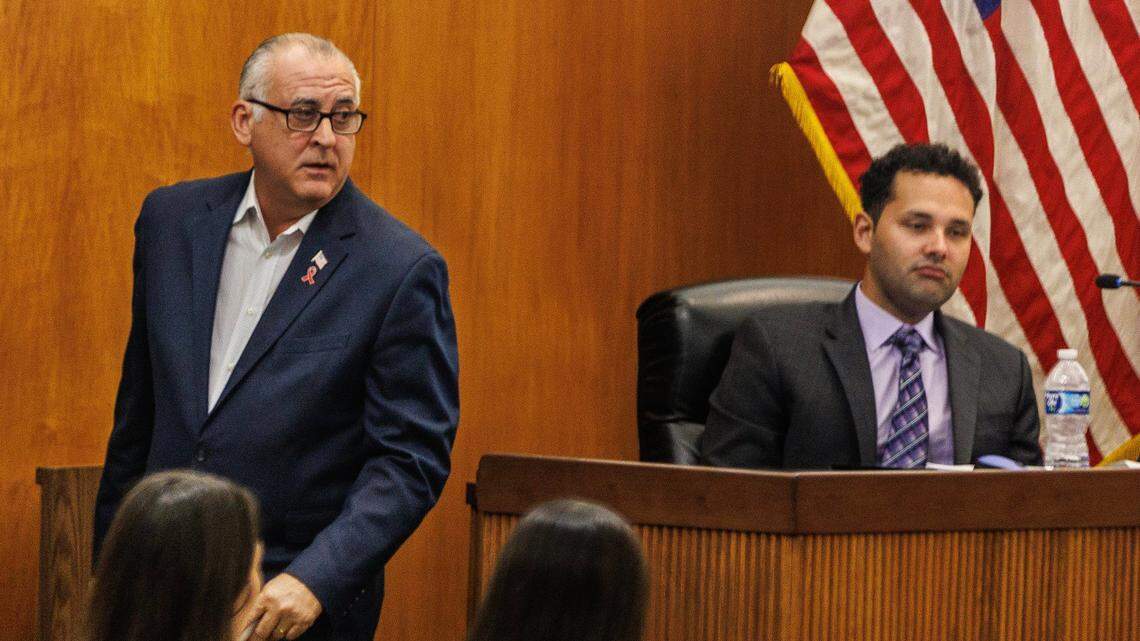 City of Hialeah Mayor Esteban Bovo, Jr. walks by councilman Bryan Calvo, during a council meeting at city hall, on Tuesday, October 24, 2023, when Bovo was informed about the lawsuit that Calvo filed against him