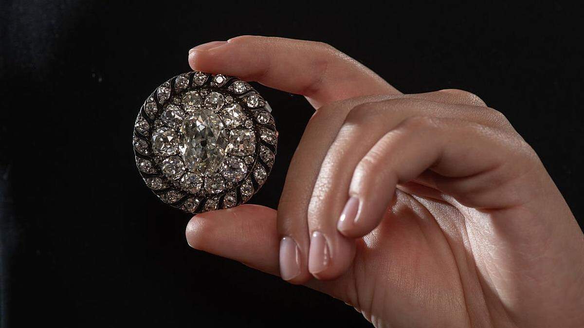 GENEVA, SWITZERLAND - NOVEMBER 6: Historically Important and Highly Significant Diamond Brooch/Pendant, an old mine-cut diamond brooch or pendant, owned by Emperor Napoleon I circa 1810 (Est. 120,000 - 200,000 CHF) is displayed as the Sotheby's unveiled this morning a selection of its top lots, representative of its Geneva Luxury Sales which officially open tomorrow with all lots from the High Jewelry, Royal and Noble, Anniversary Breguet Watches and Important Watches sales going on public display before their respective auctions Sunday 9th November for all watches and Tuesday 12th November for all jewellery. The unveiling showcased pieces from all four sales, led by Sotheby's Luxury Sales' most valuable lot, The Glowing Rose, a rare pink diamond of 10.08 carats in weight estimated in the region of $20 million (around 16 million CHF) and distinguished by its pure pink colour an extremely rare phenomenon when virtually all pink diamonds feature a secondary or even third hue within their main pink shade. Other highlights included a highly important and historical diamond hat button (estimate 120,000 200,000 CHF) Emperor Napoleon I wore on his bicorne and which he lost near Waterloo when he fled the debacle on the battlefield and the Mercedes Gleitze Rolex Oyster wristwatch (estimate in excess of 1 million CHF), a historical and highly important watch which was worn by Mercedes Gleitze, the first British woman to cross the Channel, on her celebrated Vindication Swim. That Vindication Swim proved Rolex's claim to have invented the world's first practical, waterproof, dustproof wristwatch as the watch came out pristine from the gruelling endurance test. As a result, the watch, combined with Gleitze's existing fame and that of her record breaking swim, gave Rolex a hitherto little known watch brand the global exposure it needed to grow to the brand it is today. (Photo by Robert Hradil/Getty Images for Sotheby's)