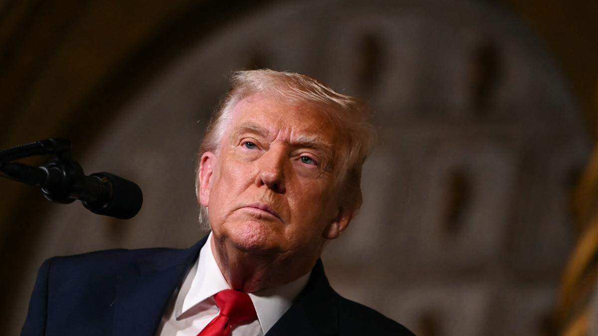 US President Donald Trump takes questions from journalists after announcing the US Navy's new Golden Fleet initiative, unveiling a new class of warships, at Mar-a-Lago in Palm Beach, Florida, on December 22, 2025. President Donald Trump on December 22 announced a new class of heavily armed warships that will be named after himself -- an honor usually reserved for US leaders who have left office. Two of the Trump-class ships will be built initially but that number could grow substantially in the future, according to the president, who said they will be "some of the most lethal surface warfare ships" and "the largest battleship in the history of our country." Trump made the announcement at his Mar-a-Lago residence in Florida alongside Pentagon chief Pete Hegseth, Secretary of State Marco Rubio and Navy Secretary John Phelan, with images of the planned high-tech vessels on stands nearby. (Photo by ANDREW CABALLERO-REYNOLDS / AFP via Getty Images)
