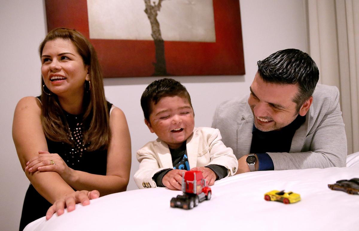Nicholas Torrico, 4, with his parents Gabriela Torrico and Freddy Baluarte, wait to meet Micah Kadden, a Washington, D.C., pediatrician who donated life-saving bone marrow to Nicholas. They finally met during Gift of Life Marrow Registry’s “Celebrating Life” event in Miami on Thursday, November 14, 2019.