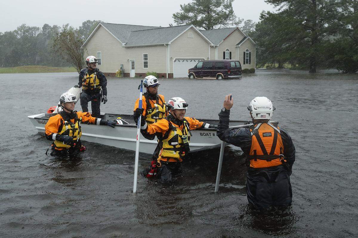 Volunteer rescuers searched for victims near Fairfield, North Carolina on Friday.