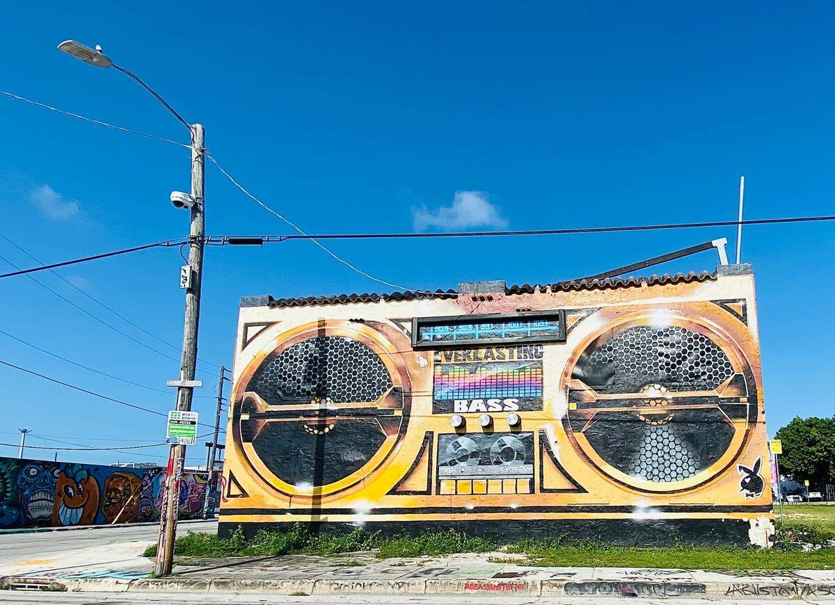 An old house converted into a “boombox” that represents Miami bass music