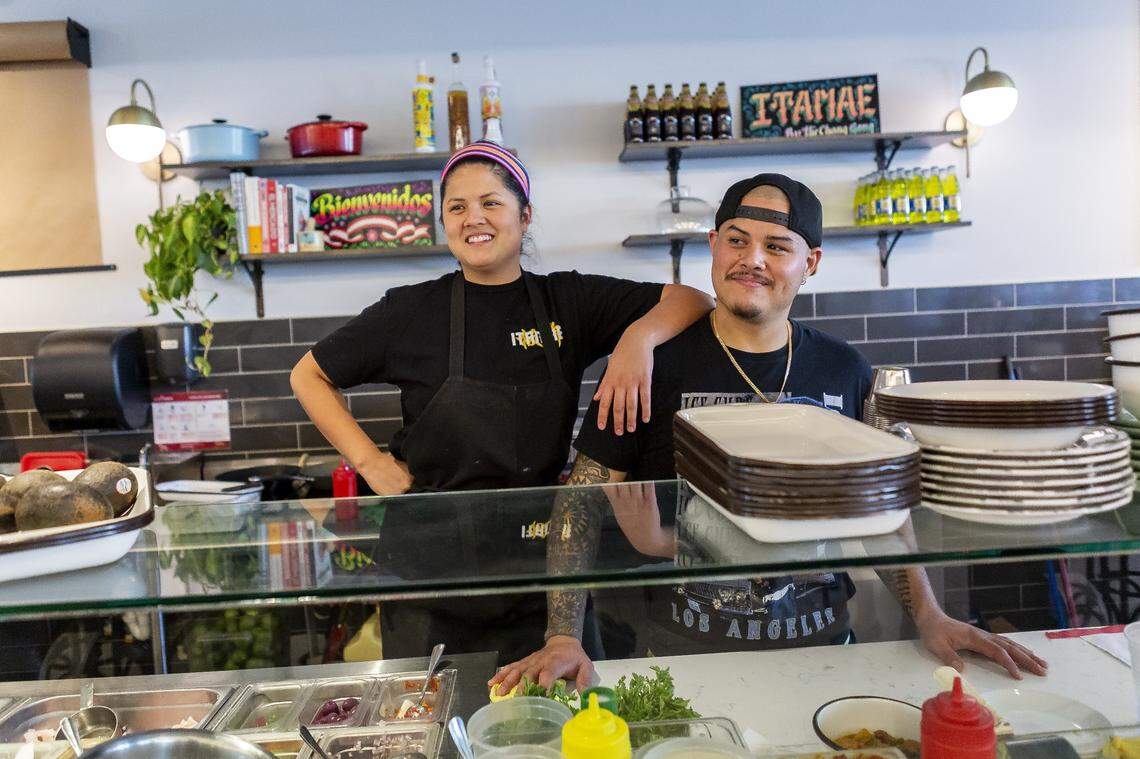Chefs Val and Nando Chang at the counter of the original Itamae at the former St. Roch Market (now MIA Market), which opened in 2018.