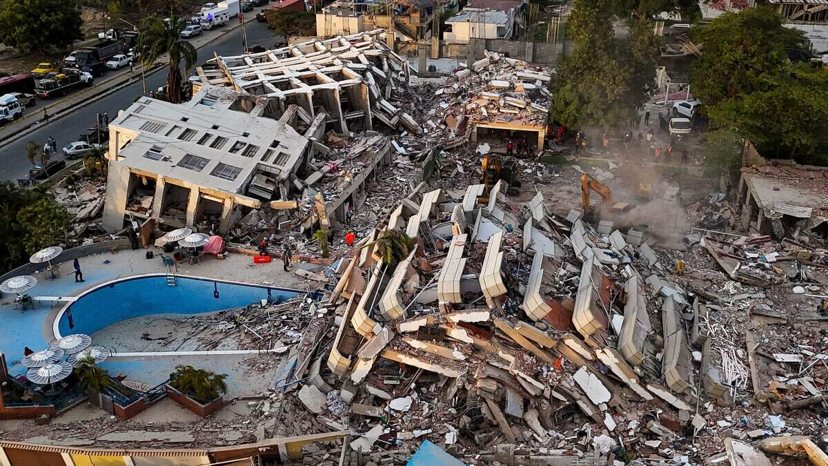 TOPSHOT - This aerial view shows buildings destroyed following twin earthquakes in Caraballeda, La Guaira State, Venezuela, on June 29, 2026. Hopes were fading of finding survivors more than four days after powerful twin earthquakes struck Venezuela, as residents grow increasingly frustrated with the government's response to the disaster that has killed -up to now- more than 1,700 people and left tens of thousands unaccounted for. (Photo by Miguel MEDINA / POOL / AFP via Getty Images)