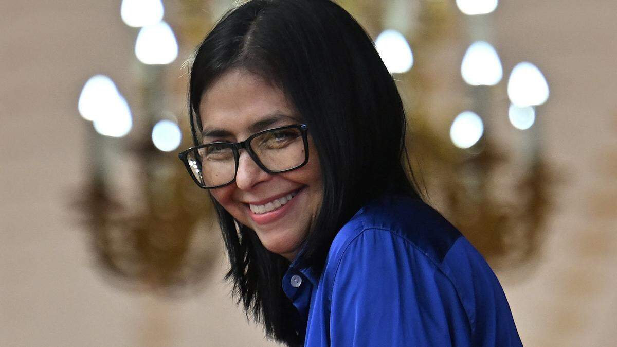 Venezuela's interim President Delcy Rodriguez smiles during a press conference at the Miraflores Presidential Palace in Caracas on January 14, 2026. Venezuela's interim president Delcy Rodriguez said on January 14, that her country was looking to "a new political era" after the January 3 ouster of leader Nicolas Maduro in a US military strike. (Photo by Juan BARRETO / AFP via Getty Images)