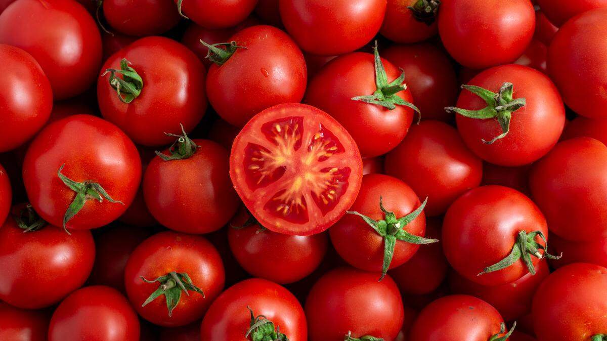 cut red tomato close-up in a box in the market