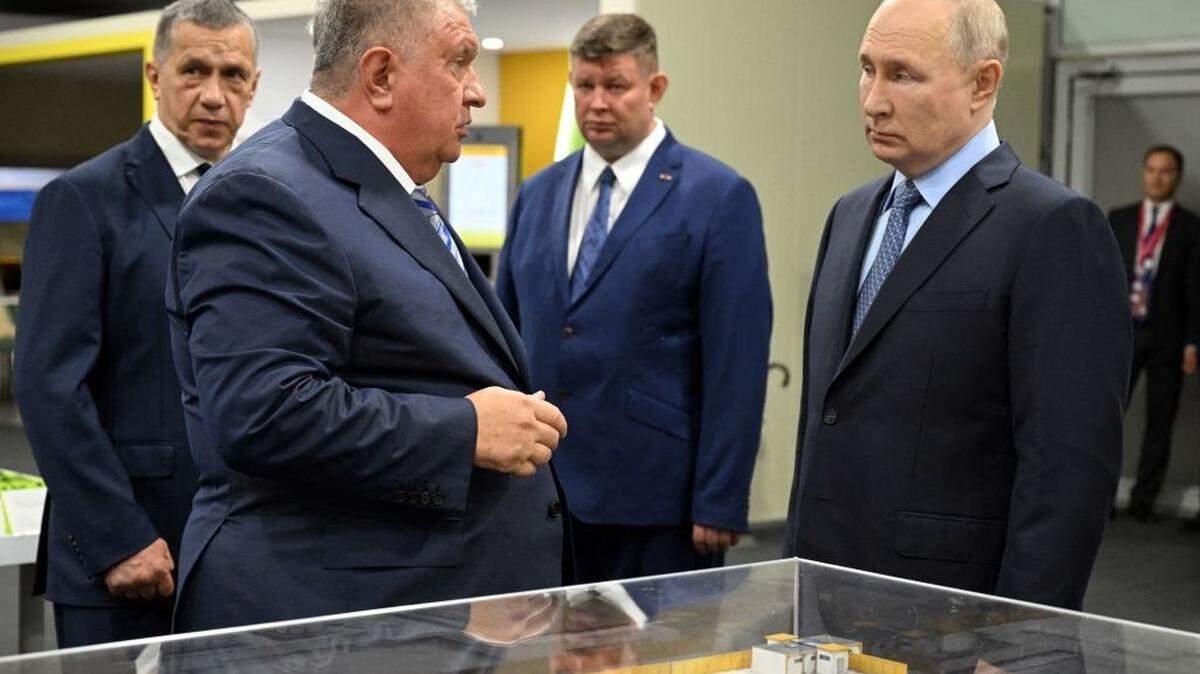 In this pool photograph distributed by Sputnik agency Russia's President Vladimir Putin (R) talks with Rosneft CEO Igor Sechin (L) after the naming ceremony of the Arctic tanker-gas carrier "Alexey Kosygin" and the tanker-shuttle "Valentin Pikul" at the Zvezda shipbuilding complex, in Primorsky Krai region on September 11, 2023. Russian President Vladimir Putin (R) and Rosneft CEO Igor Sechin (L) are seen after the naming ceremony of the Arctic tanker-gas carrier "Alexey Kosygin" and the tanker-shuttle "Valentin Pikul" at the Zvezda shipbuilding complex in Primorsky Krai region on September 11, 2023. Pavel Bednyakov / POOL/AFP (Photo by Pavel Bednyakov / POOL / AFP) (Photo by PAVEL BEDNYAKOV/POOL/AFP via Getty Images)
