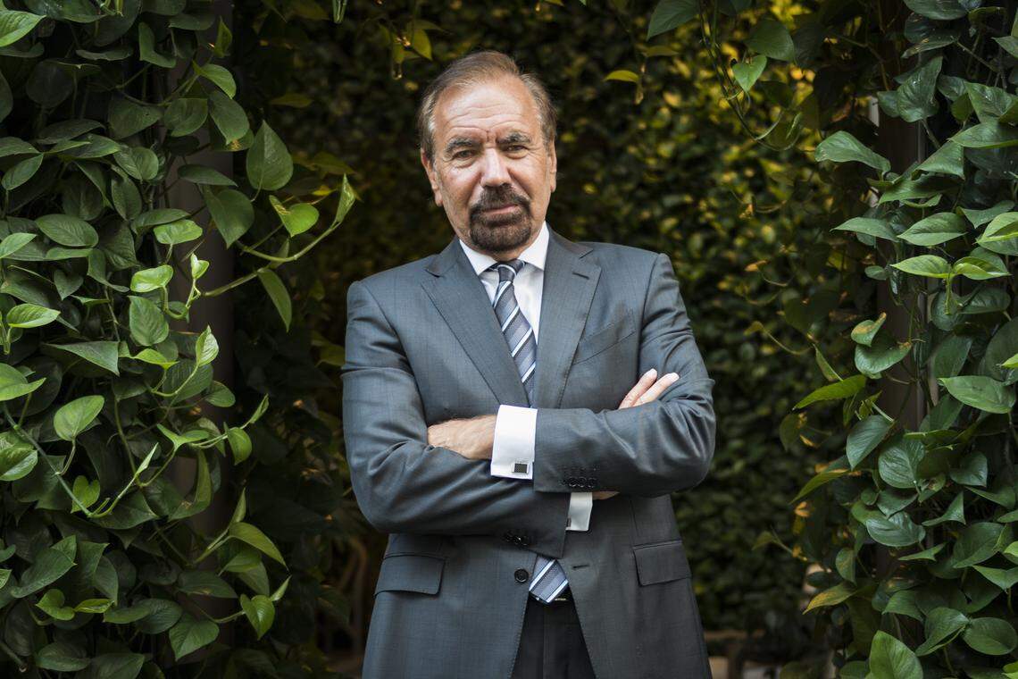 Developer and art patron Jorge Pérez poses at one of his newest Miami projects, the SLS Lux Brickell.