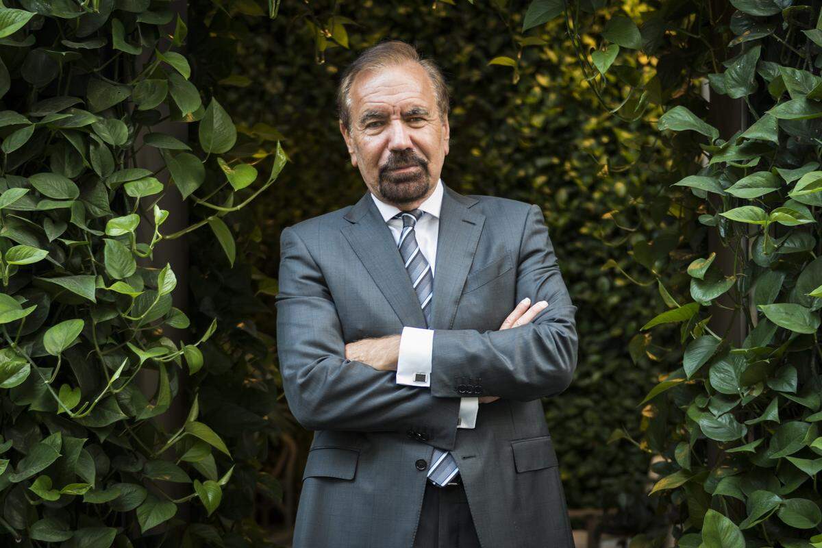 Developer and art patron Jorge Pérez poses at one of his newest Miami projects, the SLS Lux Brickell.