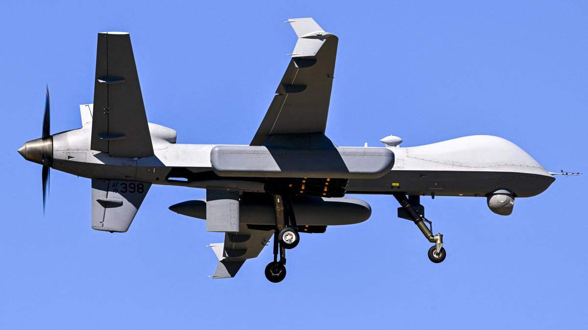 A US military MQ-9 Reaper drone approaches for landing at Rafael Hernandez Airport in Aguadilla, Puerto Rico, on December 29, 2025. The United States has deployed a major military force in the Caribbean and has recently intercepted oil tankers as part of a naval blockade against Venezuelan vessels it considers to be under sanctions. Since September, US forces have launched dozens of air strikes on boats that Washington alleges, without showing evidence, were transporting drugs. More than 100 people have been killed. (Photo by Miguel J. Rodriguez Carrillo / AFP via Getty Images)