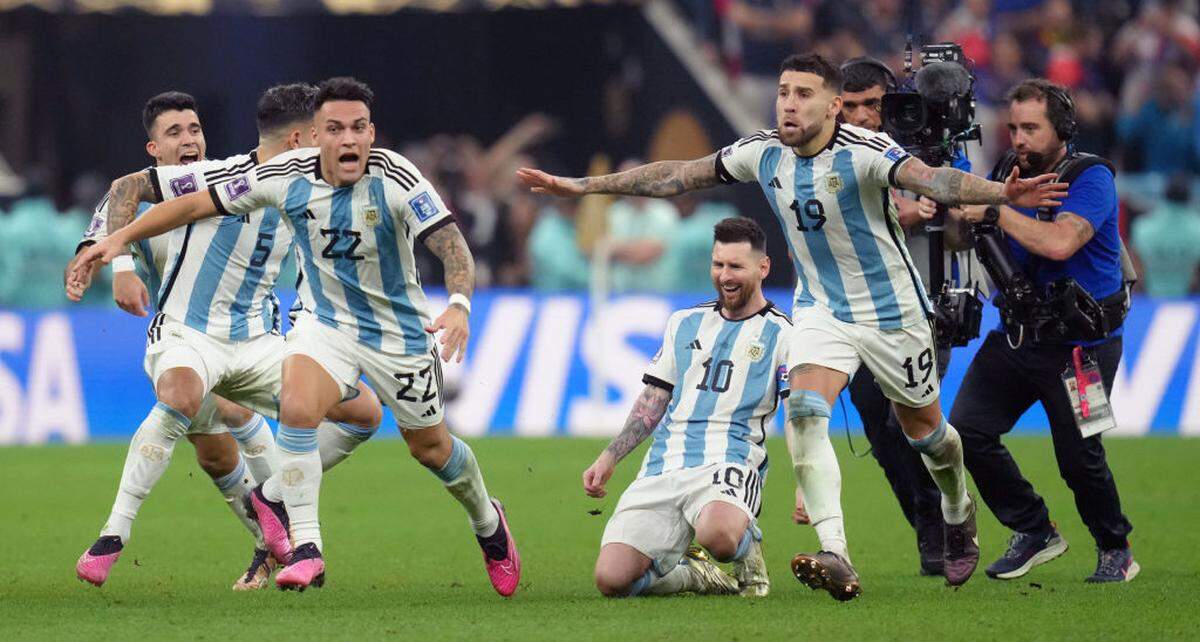 Argentina's Lionel Messi falls to his knees in celebration after a shootout victory in the 2022 World Cup final at Lusail Stadium in Qatar.