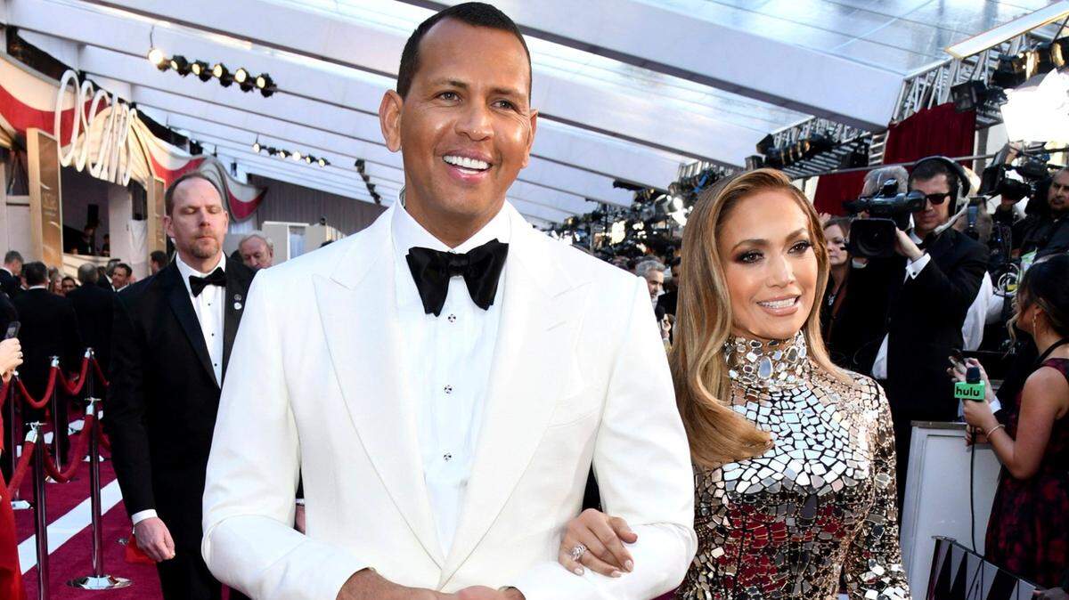 Alex Rodriguez and his fiancée Jennifer Lopez walk the red carpet at the 2019 Oscars ceremony in Los Angeles.