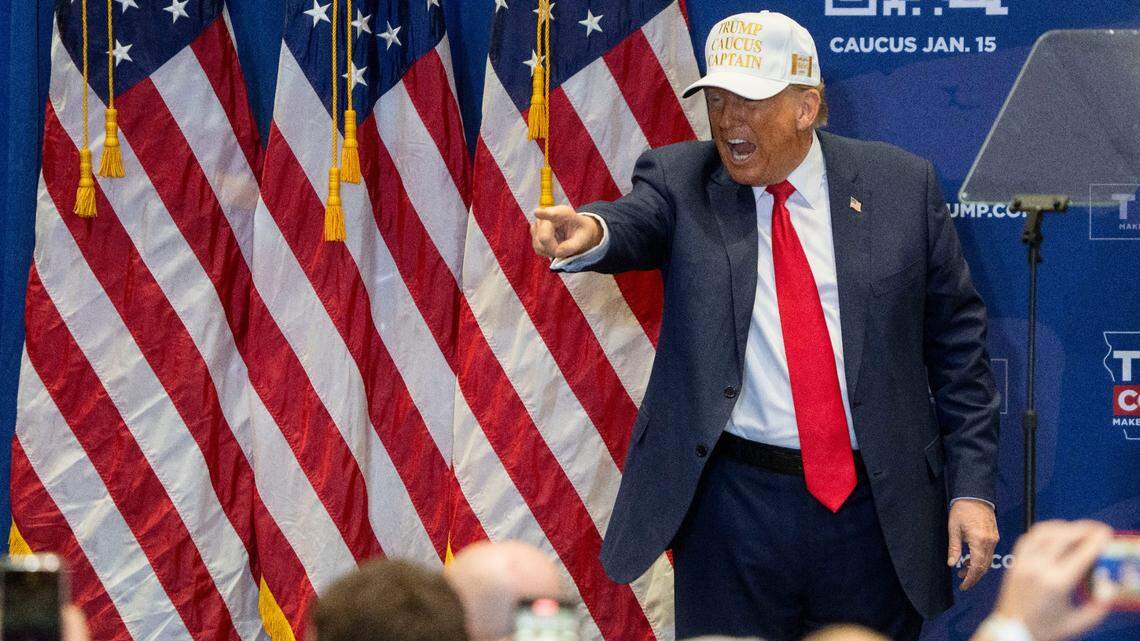 Former President Donald Trump points to the crowd during a campaign event ahead of the Iowa caucuses, on Jan. 14, 2024, at Simpson College in Indianola.