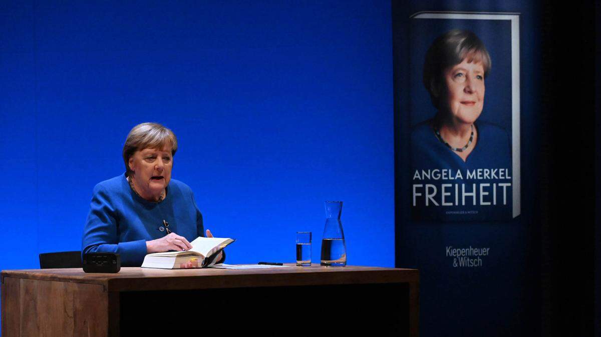 29 November 2024, Mecklenburg-Western Pomerania, Stralsund: Former Chancellor Angela Merkel sits on the stage of the theater in Stralsund at the presentation of her book “Freiheit. Memories 1954 - 2021”. Together with her long-time office manager Baumann, former Chancellor Merkel wrote her memoirs. Photo: Stefan Sauer/dpa/Sipa USA