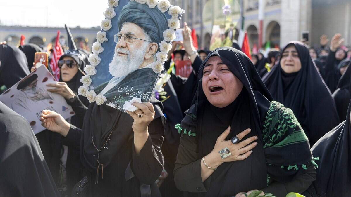 TEHRAN, IRAN - JULY 4: A woman weeps as people gather at the Imam Khomeini Grand Mosalla for a farewell ceremony for Iran's late Ayatollah Ali Khamenei on July 4, 2026 in Tehran, Iran. Khamenei and members of his family were killed on February 28 during U.S.-Israeli strikes at the beginning of the war, bringing an end to his 36-year rule over Iran. A multi-city state funeral will be held over six days before his body is laid to rest on July 9, in his hometown of Mashhad, Iran. (Photo by Majid Saeedi/Getty Images)