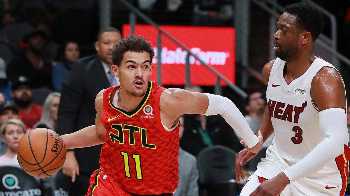 Atlanta Hawks guard Trae Young drives against Miami Heat Dwyane Wade during the first half on Sunday, Jan. 6, 2019 at State Farm Arena in Atlanta, Ga. (Curtis Compton/Atlanta Journal-Constitution/TNS)