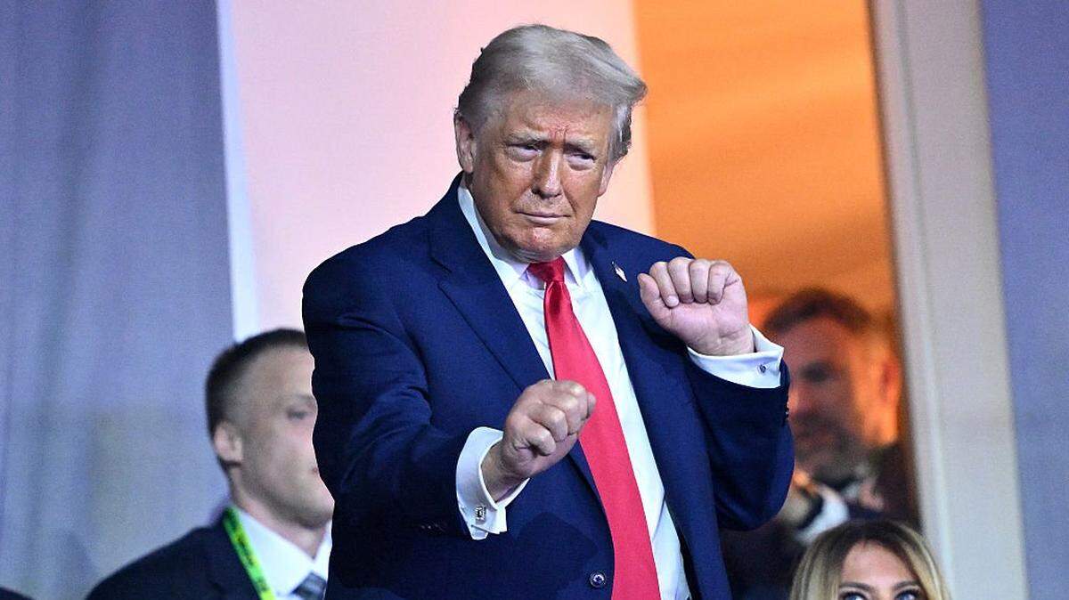 WASHINGTON, DC - DECEMBER 05: U.S. President Donald Trump dances to the final performance of the Village People during the FIFA World Cup 2026 Official Draw at John F. Kennedy Center for the Performing Arts on December 05, 2025 in Washington, DC. (Photo by Mandel NGAN - Pool/Getty Images)