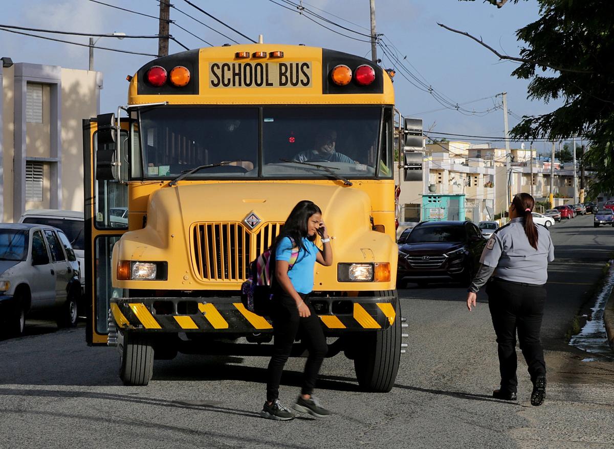 Students arrive at Rosa Costa Valdivieso Middle School in Yabucoa on Monday, Aug. 13, 2018. It was the first day of a new school year in Puerto Rico, almost a year after Hurricane Maria devastated the island.