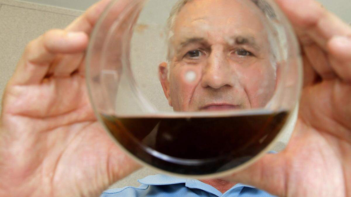 At the end of the rainy season, Miami-Dade County Chief Dr. Bill Petrie looks through sample water where larvae were extracted during his interview at the county mosquito control department during a visit to the county’s lab on Tuesday, October 23, 2018.