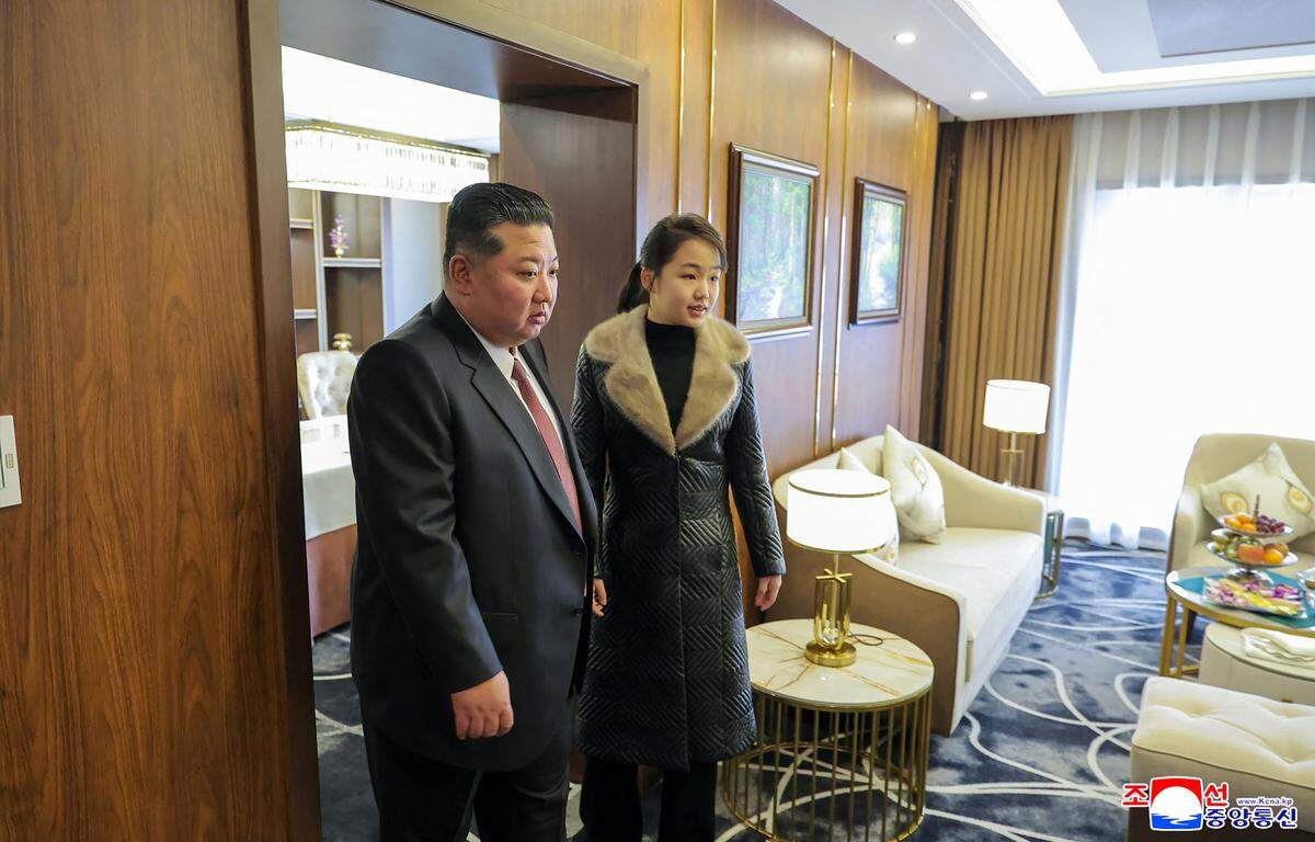 This picture taken on December 20, 2025 and released by North Korea's official Korean Central News Agency (KCNA) via KNS on December 23, 2025 shows North Korean leader Kim Jong Un (L) and his daughter Ju Ae inspecting the Ikkal Hotel, which was recently completed in the Samjiyon tourist district of Ryanggang Province. (Photo by KCNA VIA KNS / AFP via Getty Images) / South Korea OUT / ---EDITORS NOTE--- RESTRICTED TO EDITORIAL USE - MANDATORY CREDIT "AFP PHOTO/KCNA VIA KNS" - NO MARKETING NO ADVERTISING CAMPAIGNS - DISTRIBUTED AS A SERVICE TO CLIENTS THIS PICTURE WAS MADE AVAILABLE BY A THIRD PARTY. AFP CAN NOT INDEPENDENTLY VERIFY THE AUTHENTICITY, LOCATION, DATE AND CONTENT OF THIS IMAGE. /