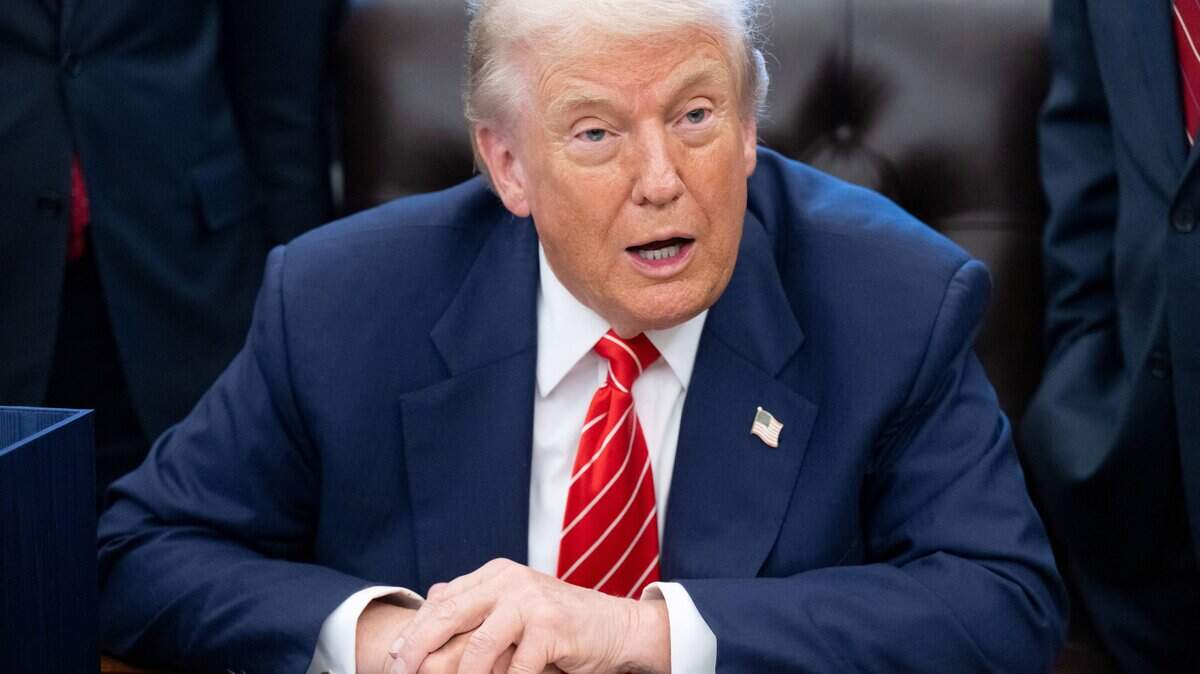 US President Donald Trump speaks with the media after signing a funding bill to end a partial government shutdown in the Oval Office of the White House in Washington, DC, February 3, 2026. The US House of Representatives passed a spending bill on Tuesday ending the four-day partial government shutdown sparked by Democratic opposition to funding for the federal agency carrying out President Donald Trump's immigration crackdown. (Photo by SAUL LOEB / AFP via Getty Images)