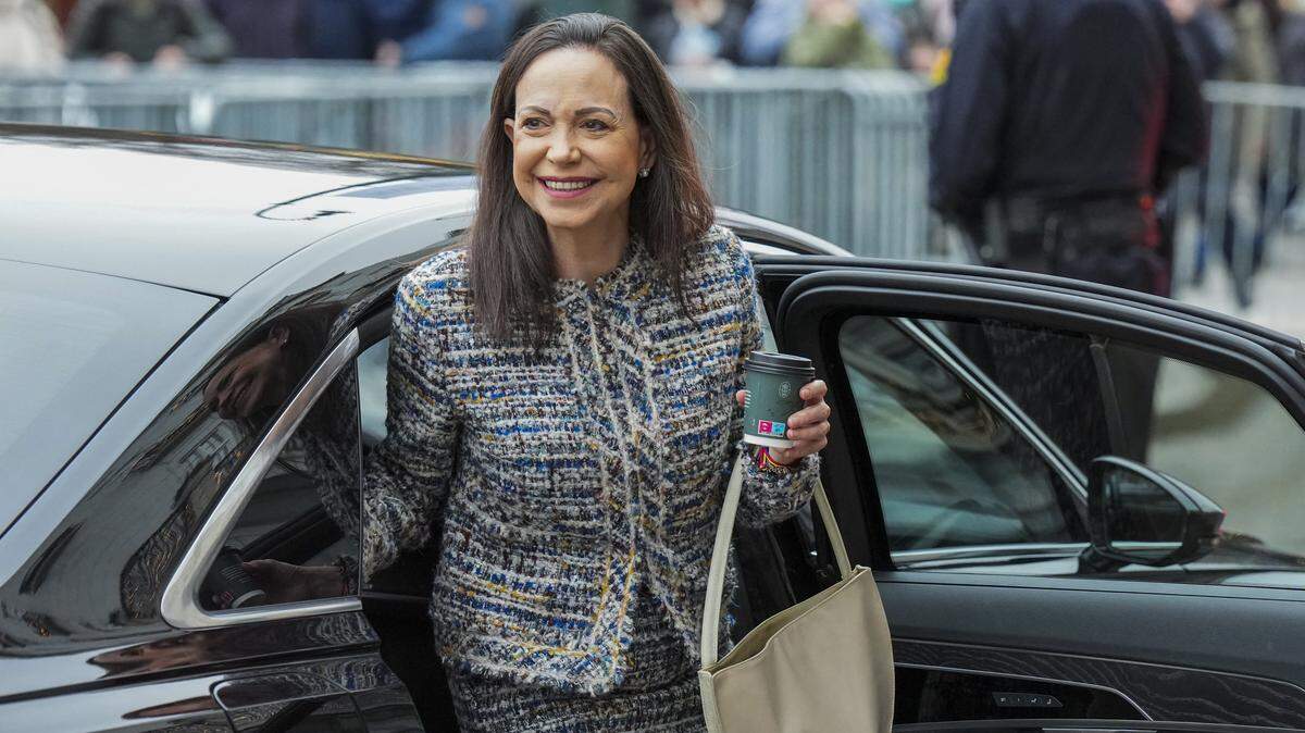 Nobel Peace Prize 2025 laureate Venezuelan opposition leader Maria Corina Machado gets out of a car in front of the Grand Hotel in Oslo, Norway, after an audience at the Royal Palace. Machado -- who vanished in January 2025 after challenging the rule of Venezuelan President Nicolas Maduro -- won the 2025 Peace Prize for "her struggle to achieve a just and peaceful transition from dictatorship to democracy". (Photo by Ole Berg-Rusten / NTB / AFP via Getty Images) / Norway OUT