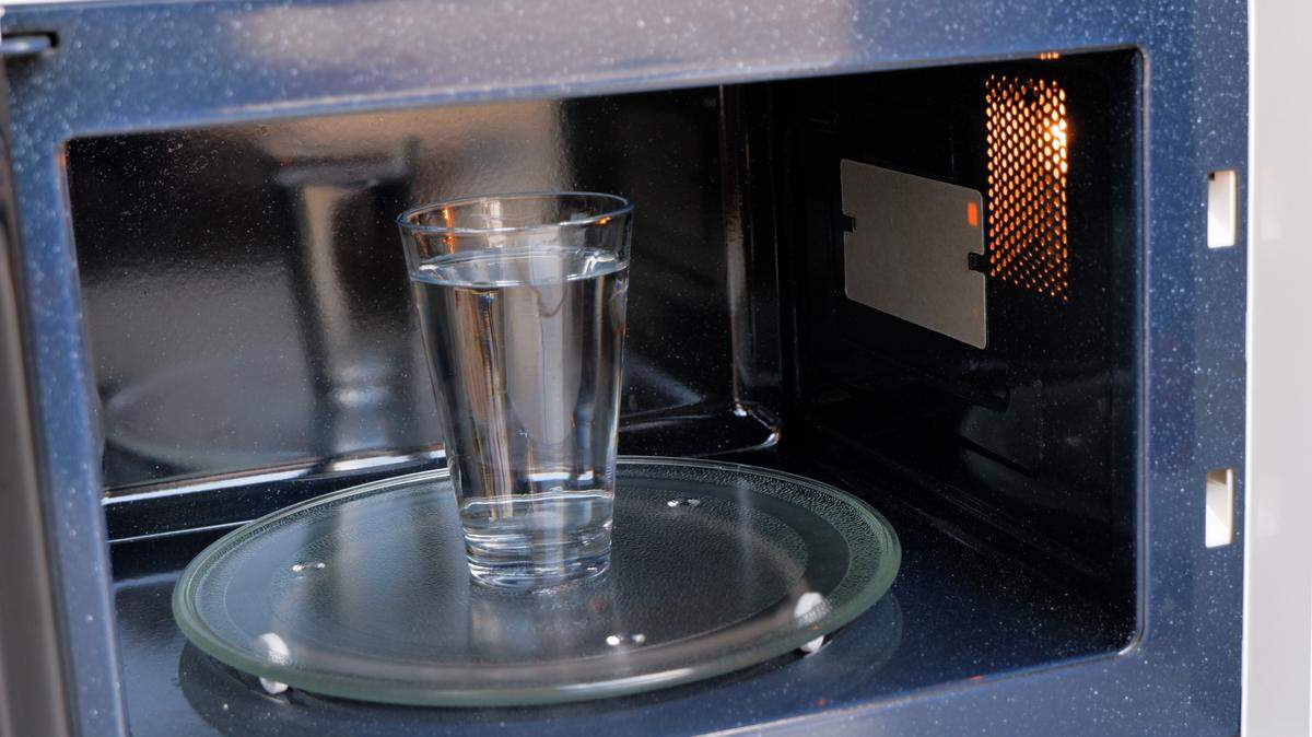 Inside View of a glass of water heating in the microwave