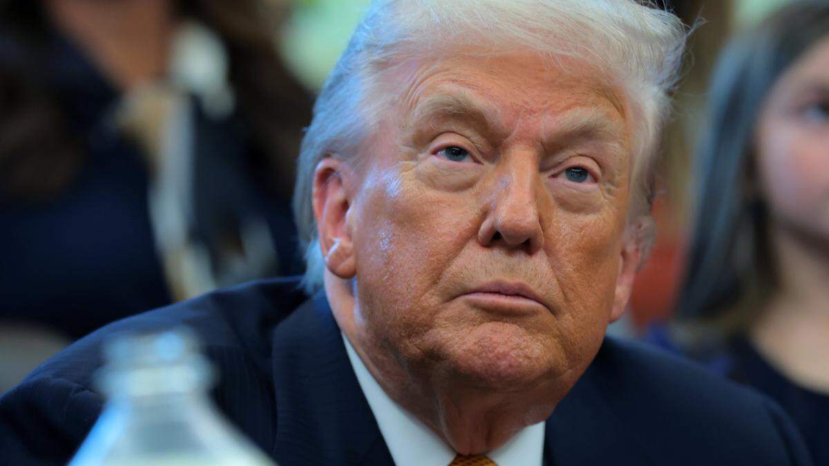 WASHINGTON, DC - JANUARY 14: U.S. President Donald Trump looks on during a bill signing event with dairy farmers in the Oval Office of the White House on January 14, 2026 in Washington, DC. Trump signed a series of bills including the "Whole Milk for Healthy Kids Act" to allow the sale of whole milk in school cafeterias across the country. (Photo by Anna Moneymaker/Getty Images)