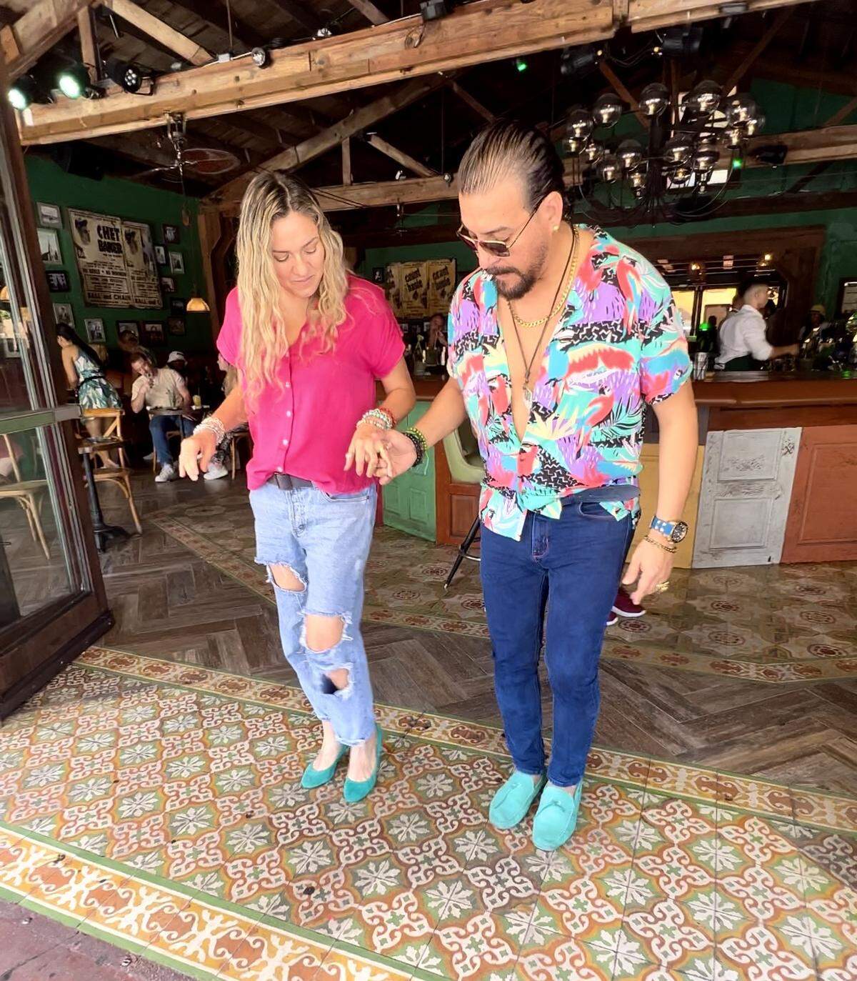 Jessica Serrano (left) gets free salsa classes at Ball & Chain in Little Havana.
