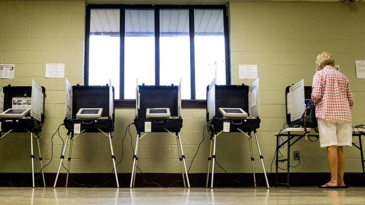 WOODY MARSHALL/THE TELEGRAPH.Macon, Georgia, 11/03/2015:.Danise Coleman, cq, cast her ballot at North Macon Park on Tuesday morning. Poll workers said that voting was light with only 14 people voting at 9:00 A.M