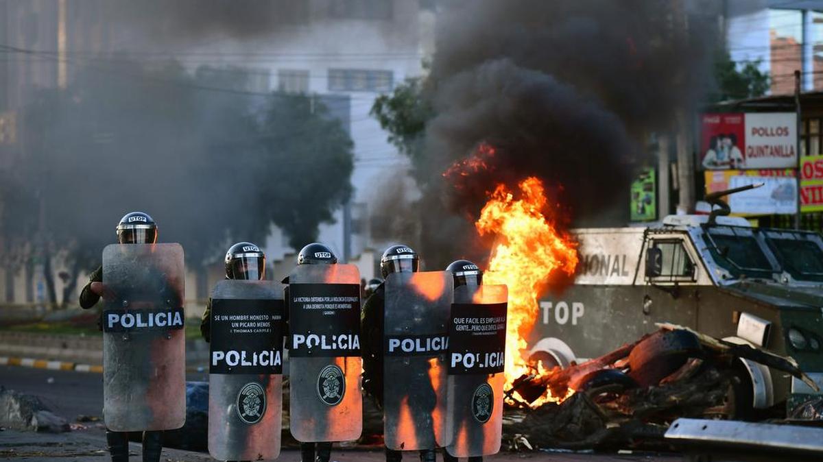 Riot police keep guard during an anti-government protest in Cochabamba, Bolivia, Nov. 18, 2019.