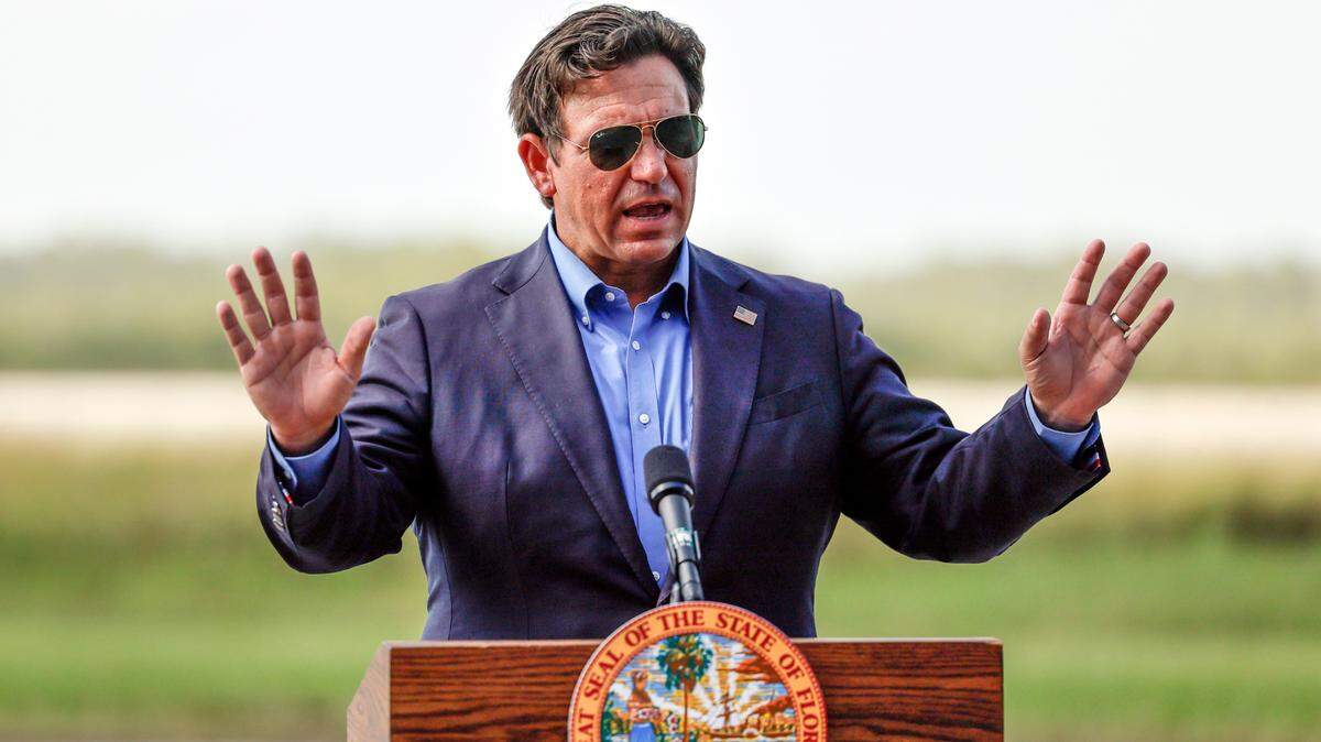Governor Ron DeSantis speaks to reporters during a press conference on the airplane runway of Alligator Alcatraz in Ochopee , Florida on Friday, July 25, 2025. 