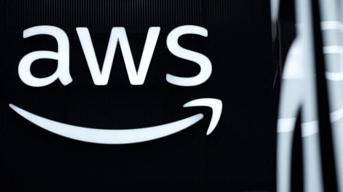 The logo of Amazon Web Services (AWS) is seen during the opening of the Hannover Messe industrial trade fair for mechanical and electrical engineering and digital industries, on March 31, 2025 in Hanover, northern Germany. The fair opens its doors to the public on March 31 and will be running until April 4, 2025. According to the Hannover Messe, "more than 4,000 companies will be acting as an interconnected industrial ecosystem and demonstrating how climate neutrality can be achieved through electrification, digitization and automation". (Photo by RONNY HARTMANN / AFP) (Photo by RONNY HARTMANN/AFP via Getty Images)
