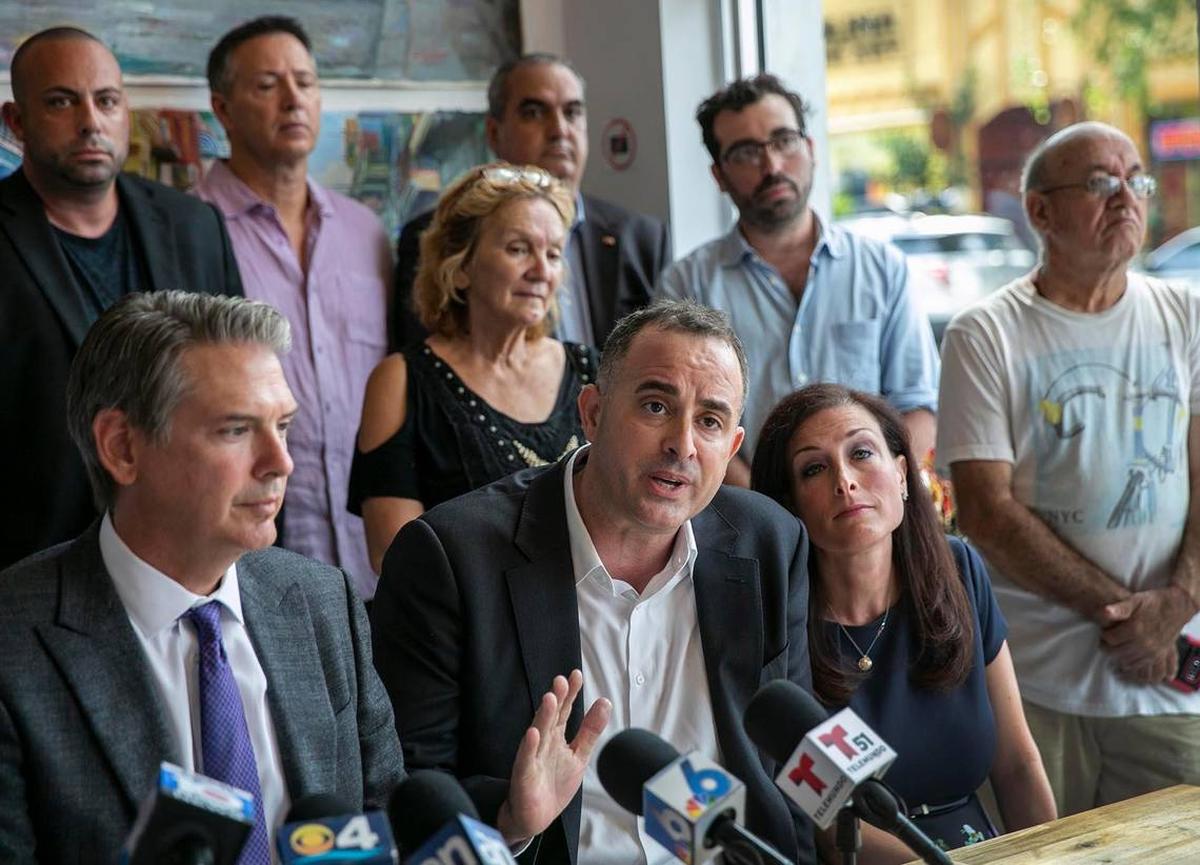 Bill Fuller, center, owner of the club Ball & Chain on Calle Ocho in Little Havana, is suing Commissioner Joe Carollo, claiming his business has been subject to targeted code enforcement.