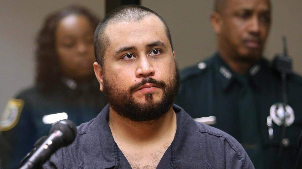 George Zimmerman, acquitted in the death of Miami teenager Trayvon Martin, listens in court in Sanford, Florida, during a 2013 hearing on charges, including aggravated assault, after a fight with a girlfriend.