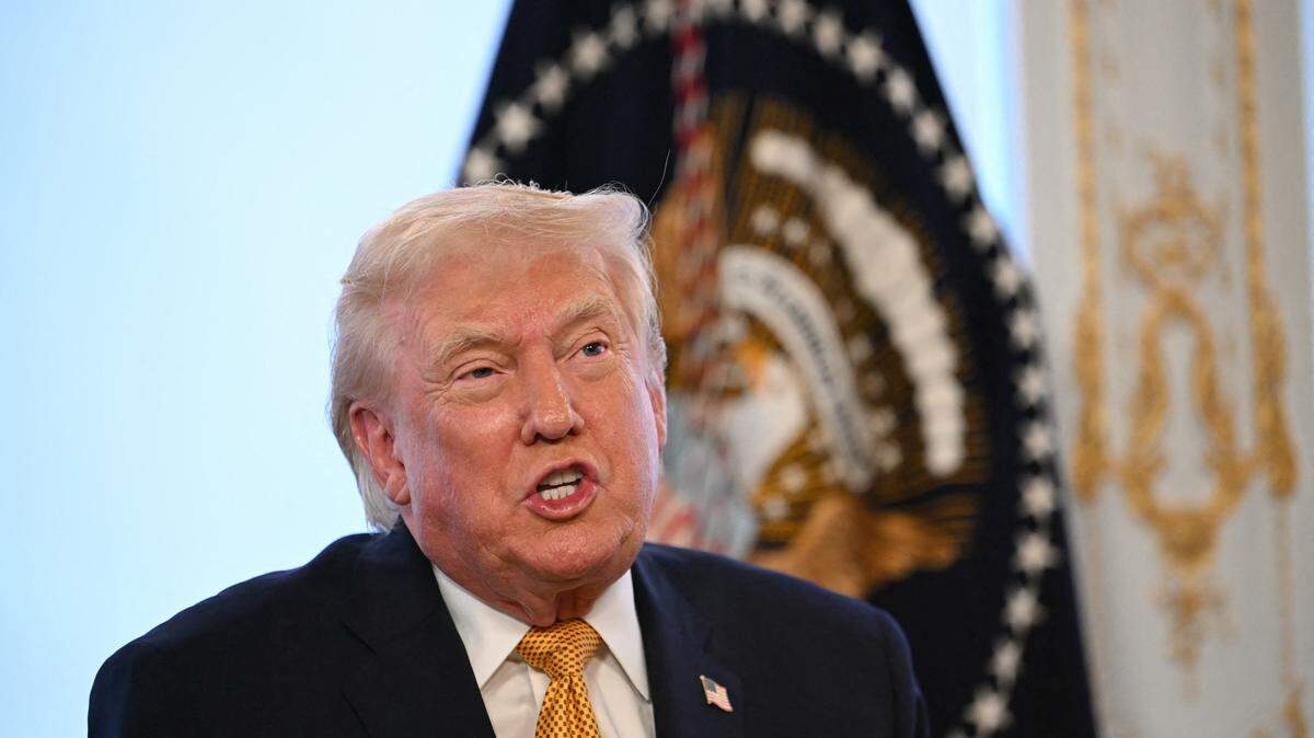 US President Donald Trump participates in calls to US service members, on Christmas Eve, from the Mar-a-Lago club in Palm Beach, Florida, December 24, 2025. (Photo by ANDREW CABALLERO-REYNOLDS / AFP via Getty Images)