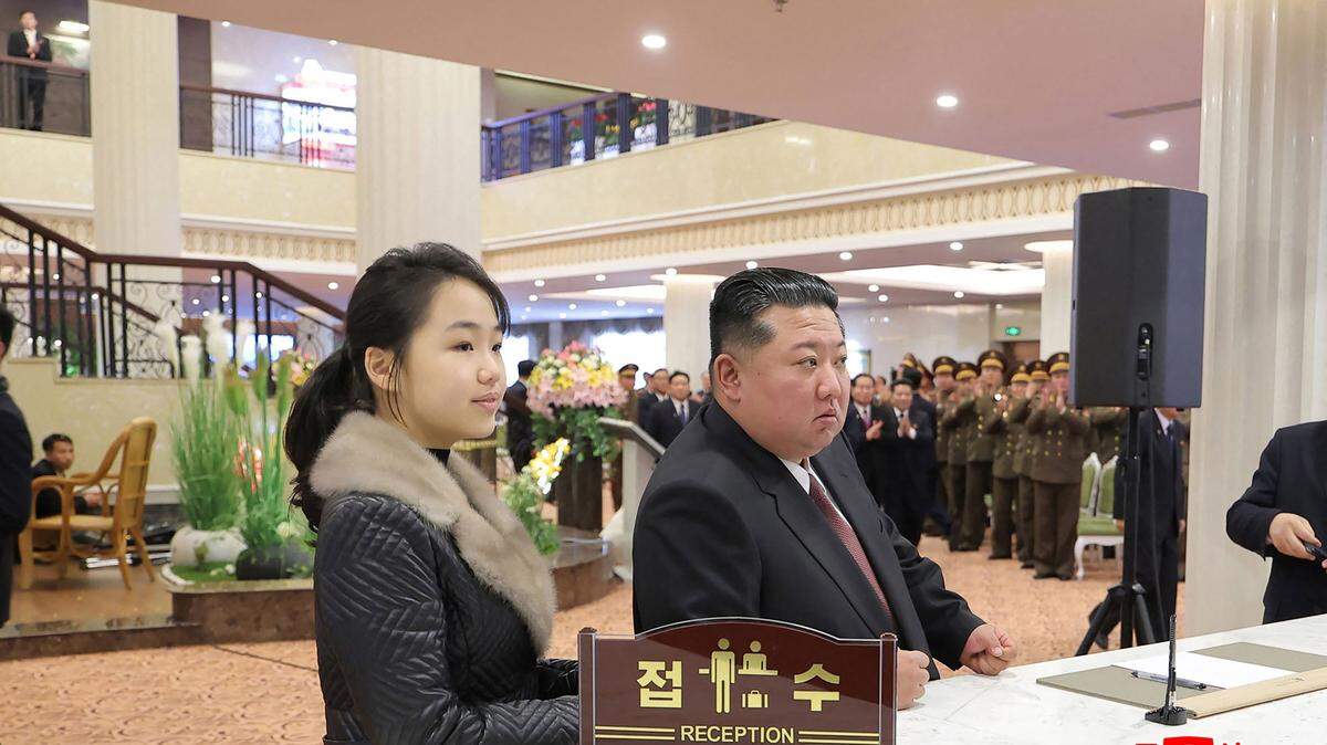 TOPSHOT - This picture taken on December 20, 2025 and released by North Korea's official Korean Central News Agency (KCNA) via KNS on December 23, 2025 shows North Korean leader Kim Jong Un (R) and his daughter Ju Ae (L) inspecting the Milyong Hotel, which was recently completed in the Samjiyon tourist district of Ryanggang Province. (Photo by KCNA VIA KNS / AFP via Getty Images) / South Korea OUT / ---EDITORS NOTE--- RESTRICTED TO EDITORIAL USE - MANDATORY CREDIT "AFP PHOTO/KCNA VIA KNS" - NO MARKETING NO ADVERTISING CAMPAIGNS - DISTRIBUTED AS A SERVICE TO CLIENTS THIS PICTURE WAS MADE AVAILABLE BY A THIRD PARTY. AFP CAN NOT INDEPENDENTLY VERIFY THE AUTHENTICITY, LOCATION, DATE AND CONTENT OF THIS IMAGE. /