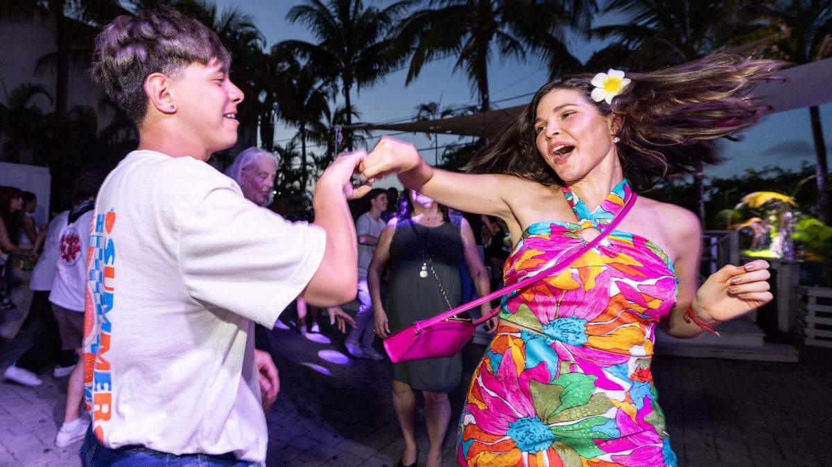 Betsabel Garcia, 28, right, and Alex Fortes, 28, left, dances salsa during a Salsa Z event at ZeyZey on Thursday, July 24, 2025, in Miami, Fla.