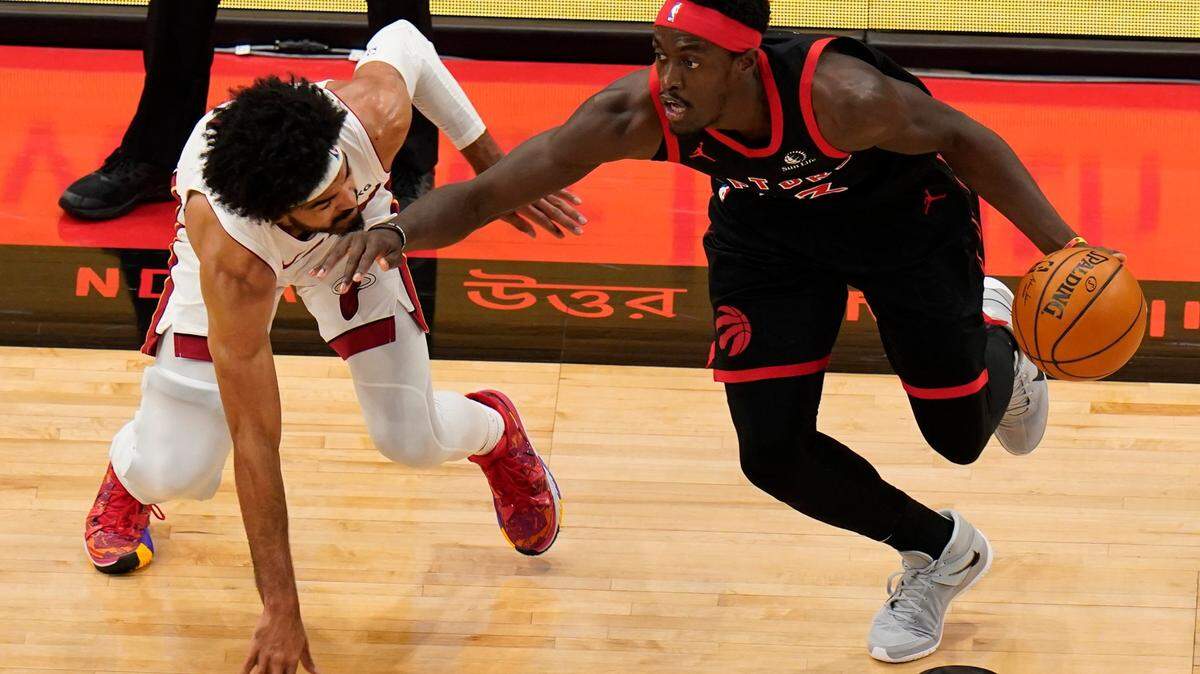 Toronto Raptors forward Pascal Siakam (43) drives past Miami Heat guard Gabe Vincent (2) during the first half of an NBA basketball game Friday, Jan. 22, 2021, in Tampa, Fla. (AP Photo/Chris O’Meara)