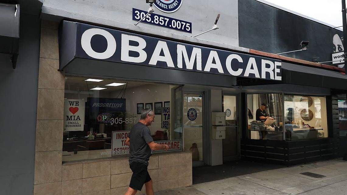 MIAMI, FLORIDA - NOVEMBER 12: An Obamacare sign is displayed outside an insurance agency on November 12, 2025 in Miami, Florida. House Democrats are said to be looking at steps to force a vote on extending the expiring Affordable Care Act tax credits after Republicans did not address the issue as part of a deal to reopen the federal government. The House is expected to vote today on ending the record-long government shutdown. (Photo by Joe Raedle/Getty Images)